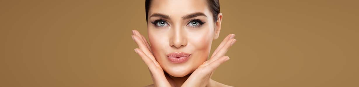 Woman showing off her rejuvenated look after getting fillers