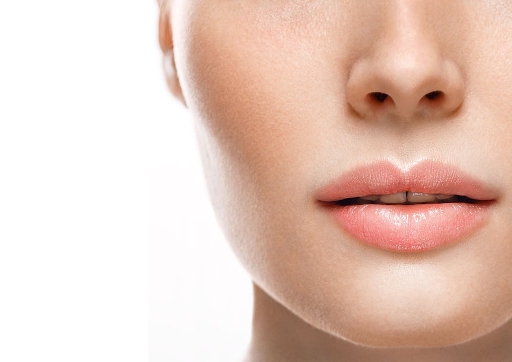 Close up of woman's plump lips from dermal filler in West Houston, TX